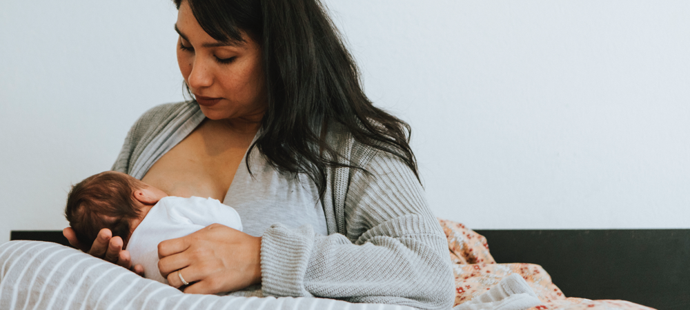 Mom breastfeeding new born
