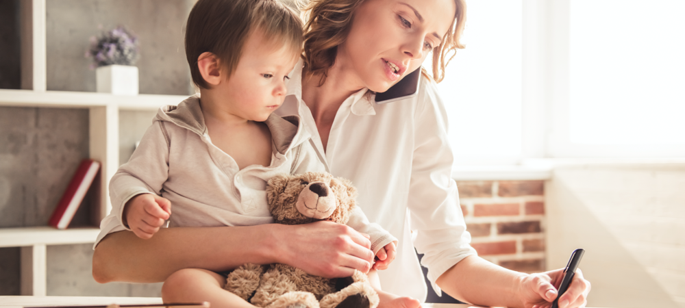 Mom working from home with child